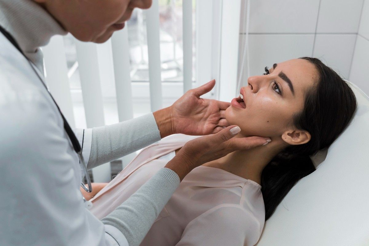 Dentist examining patient’s mouth during dental checkup